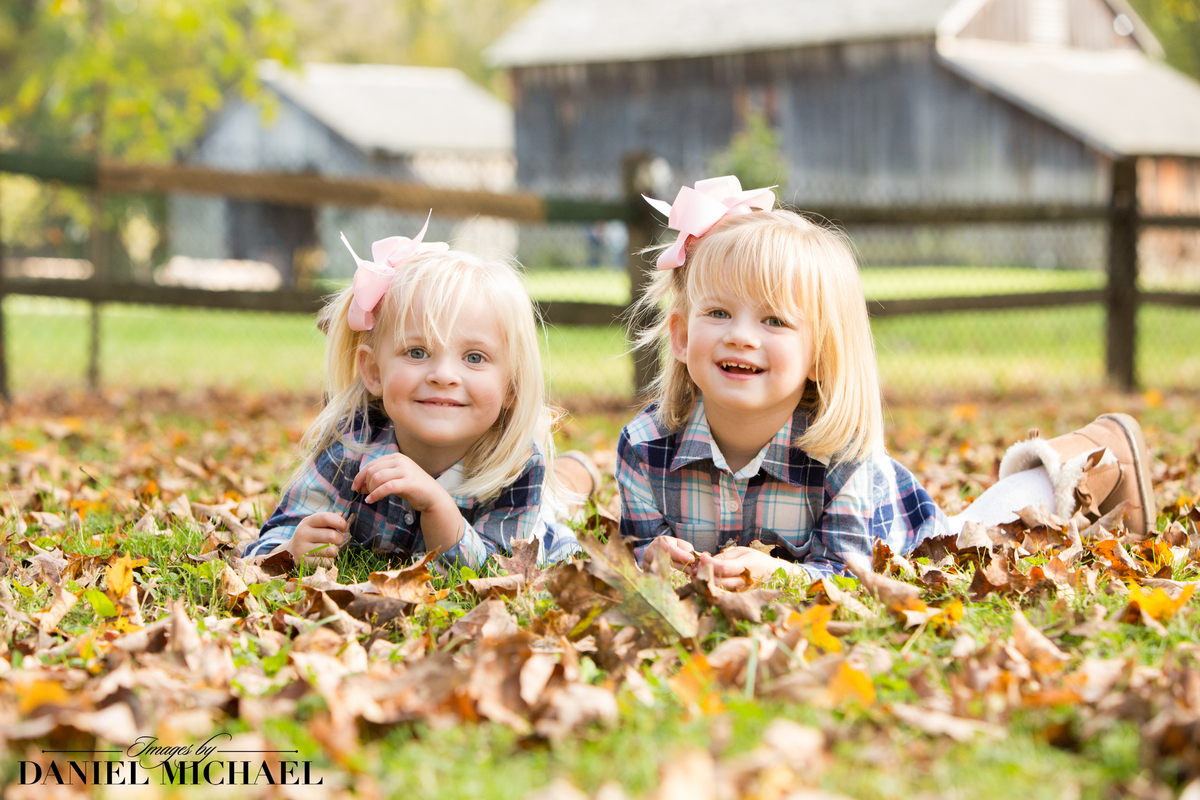 Girls smiling in leaves